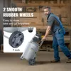 A man is pushing an air compressor in a workshop. Produktbild-Vorschau