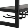 A close-up view of a black metal shelf with hooks for hanging items, likely part of a wine rack or storage unit. Podgląd zdjęcia produktu