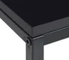 A close-up view of the corner of a black table, showing the connection between the tabletop and the metal frame, secured by a screw. Náhled obrázku produktu