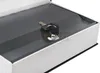 A close-up view of a book-shaped safe with two keys inserted into the lock. Anteprima dell’immagine prodotto