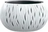 A white, decorative planter with a wavy, cut-out design. Produktbild-Vorschau