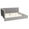 A grey upholstered bed frame with a slatted base, shown from a diagonal angle against a white background. Produktbild-Vorschau