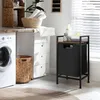 A laundry room scene with a washing machine, drawers, and a laundry basket. Podgląd zdjęcia produktu