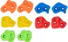 A collection of colorful climbing holds arranged in rows against a white background. Voir les images du produit