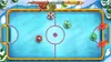 A digital illustration of an air hockey game on a screen, with cartoonish winter-themed elements. Produktbild-Vorschau