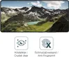 A smartphone screen displaying a mountain landscape, with two icons and text below. Produktbild-Vorschau