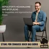 A man is sitting on a chair while using a laptop. Produktbild-Vorschau