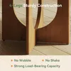 Close-up of the wooden legs of a table, highlighting its sturdy construction and stability. Voir les images du produit