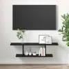 A black TV stand with a TV mounted above it, decorated with vases, books, and picture frames. Náhľad obrázku produktu