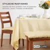 A dining table set with a tablecloth, placemats, bowls, and a vase of flowers, with a chair and bench visible. Anteprima dell’immagine prodotto