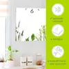 A wall clock with a floral design is shown on a wall, with product features highlighted on the right side. Produktbild-Vorschau