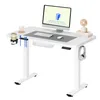A modern white standing desk with computer equipment and accessories. Podgląd zdjęcia produktu