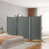 A bedroom scene with a room divider. Voir les images du produit