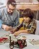 A father and son are building a wooden model steam engine together at a table. Produktbild-Vorschau