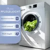 A washing machine with green laundry inside, next to a panel listing product care instructions. Produktbild-Vorschau