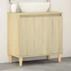 A bathroom vanity cabinet with a sink on top, set against a tiled wall. Anteprima dell’immagine prodotto