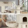 A cat tree with multiple levels and features, including a hammock and toys, shown in a home-like setting. Náhled obrázku produktu