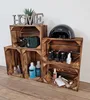 A collection of wooden crates used for storage, displaying various beauty products and decorative items. Produktbild-Vorschau