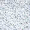 A close-up, top-down view of white marble chips. Produktbild-Vorschau