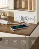 A vanity table with a built-in charging station and a smartphone charging. Produktbild-Vorschau