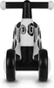 A front view of a white and black children's ride-on toy with a dalmatian pattern. Náhled obrázku produktu