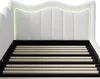 A white upholstered bed frame with a slatted base and integrated LED lighting. Produktbild-Vorschau