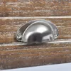 A close-up of a drawer handle on a wooden surface. Náhled obrázku produktu