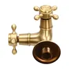 A brass wall-mounted faucet with two outlets, shown against a white background. Podgląd zdjęcia produktu