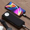 A Satechi Quatro Wireless Power Bank is shown charging an iPhone 11, with an Apple Watch and AirPods case also visible. Produktbild-Vorschau