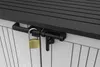 A close-up view of a black latch and a gold padlock securing a gray and white striped storage box. Náhled obrázku produktu