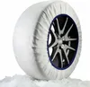 A snow sock on a car tire, resting on ice. Náhled obrázku produktu