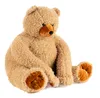 A plush teddy bear sitting on a white background. Voir les images du produit