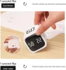 A hand is shown interacting with a digital timer, demonstrating its functionality. Produktbild-Vorschau