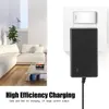 A power adapter plugged into a wall socket, with a living room scene in the background. Produktbild-Vorschau