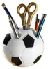 A pen holder shaped like a soccer ball, filled with pens and scissors. Produktbild-Vorschau
