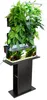 A hydroponic plant growing system with an integrated aquarium, displayed on a black stand. Anteprima dell’immagine prodotto