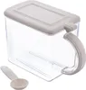 A clear studio shot of a transparent storage container with a white lid and handle, and a white spoon. Anteprima dell’immagine prodotto