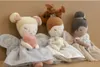 Three stuffed fairy dolls sitting side-by-side against a plain brown background. Náhled obrázku produktu