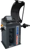 A dark gray wheel balancing machine with a black protective cover raised. Produktbild-Vorschau