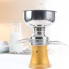 A close-up studio shot of a milk separator with a bottle of milk in the background. Náhled obrázku produktu