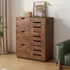 A wooden cabinet with drawers and shelves, decorated with a radio and a framed picture, placed in a room with a sofa and curtains. Náhľad obrázku produktu