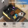 A nightstand with a charging station, showcasing its features with text overlays and icons. Produktbild-Vorschau