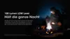 A person wearing a headlamp is camping at night, with a campfire in the foreground. Podgląd zdjęcia produktu