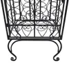 A close-up view of the lower section of a black metal wine rack, showing its decorative scrollwork and legs. Náhľad obrázku produktu