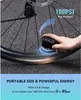 A hand holding a small black electric pump next to a bicycle tire, with text overlays describing its features. Náhľad obrázku produktu