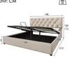 A beige upholstered bed frame with a tufted headboard and a lifting mechanism to reveal storage space underneath. Dimensions are shown in centimeters. Náhled obrázku produktu