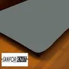 A close-up view of a gray fitted sheet on a bed, with a logo in the bottom left corner. Produktbild-Vorschau