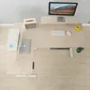 A top-down view of a height-adjustable desk with office equipment. Voir les images du produit