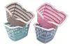 Four plastic shopping baskets are stacked in pairs, two on the left and two on the right. Náhled obrázku produktu