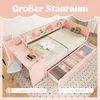 A pink children's bed with a desk and storage drawers, featuring decorative elements and text overlays. Náhľad obrázku produktu
